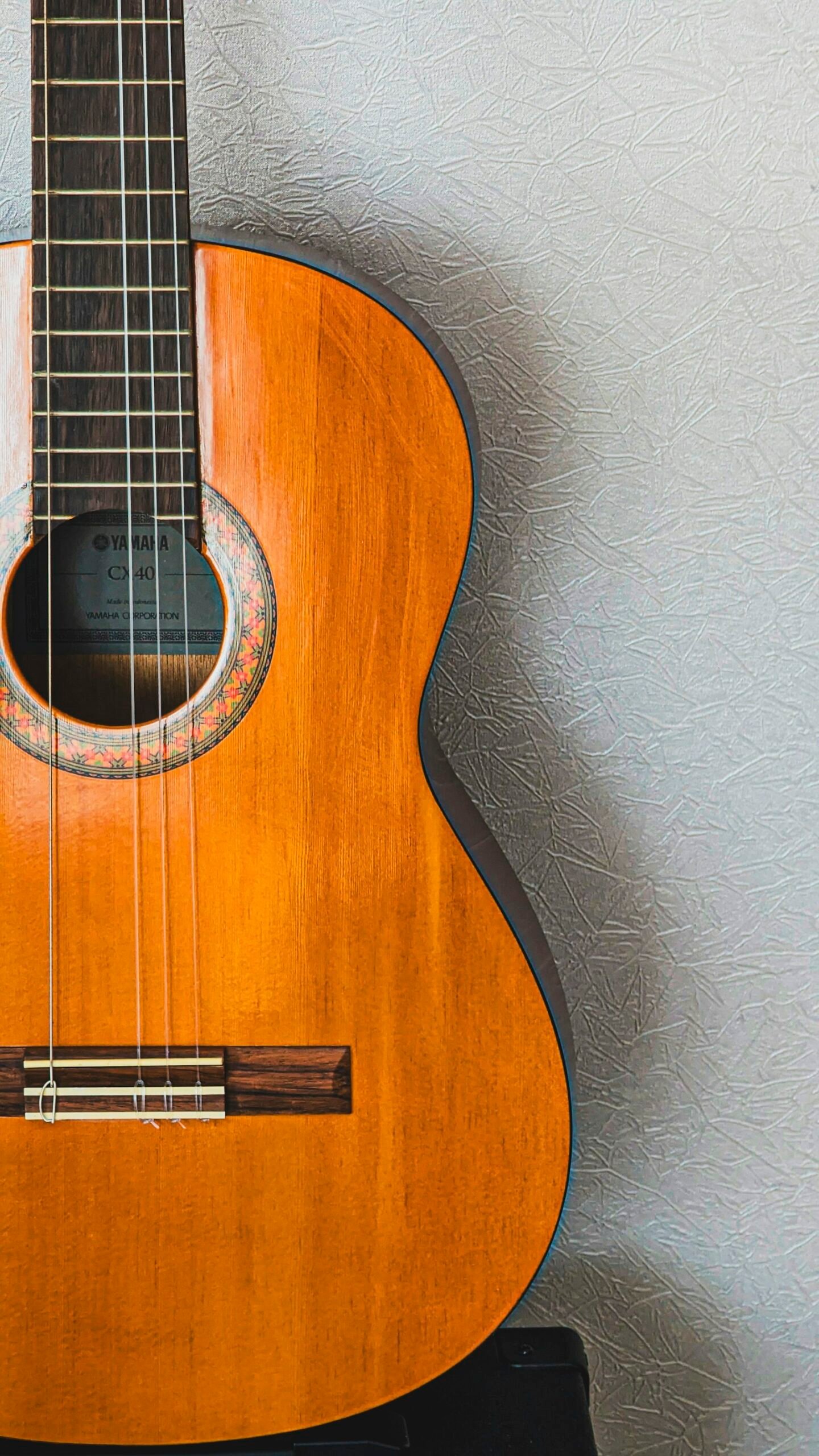 Close-up of a classical guitar body and woodwork.